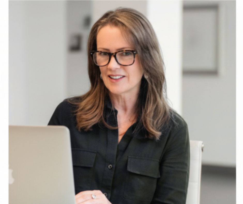 Michelle Burns seated at her computer